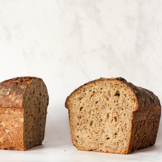 weekly rotating sourdough loaf on white background