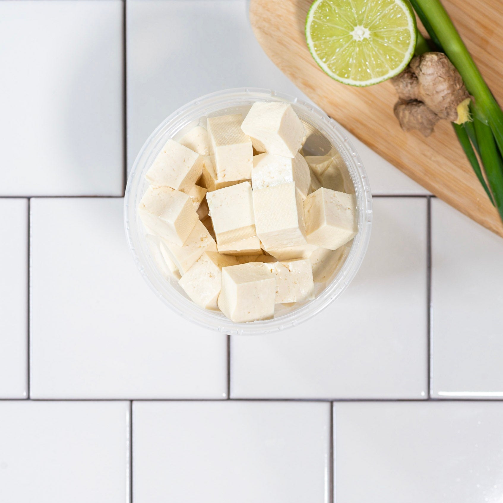 Firm Tofu on a Chopping Board with shape cutter Stock Photo - Alamy