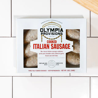 Cooked italian sausage in packaging on a tile packaground