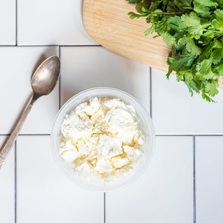 Crumbled feta cheese in a reusable container