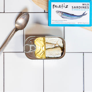 Matiz Wild Sardines in a can on tile background